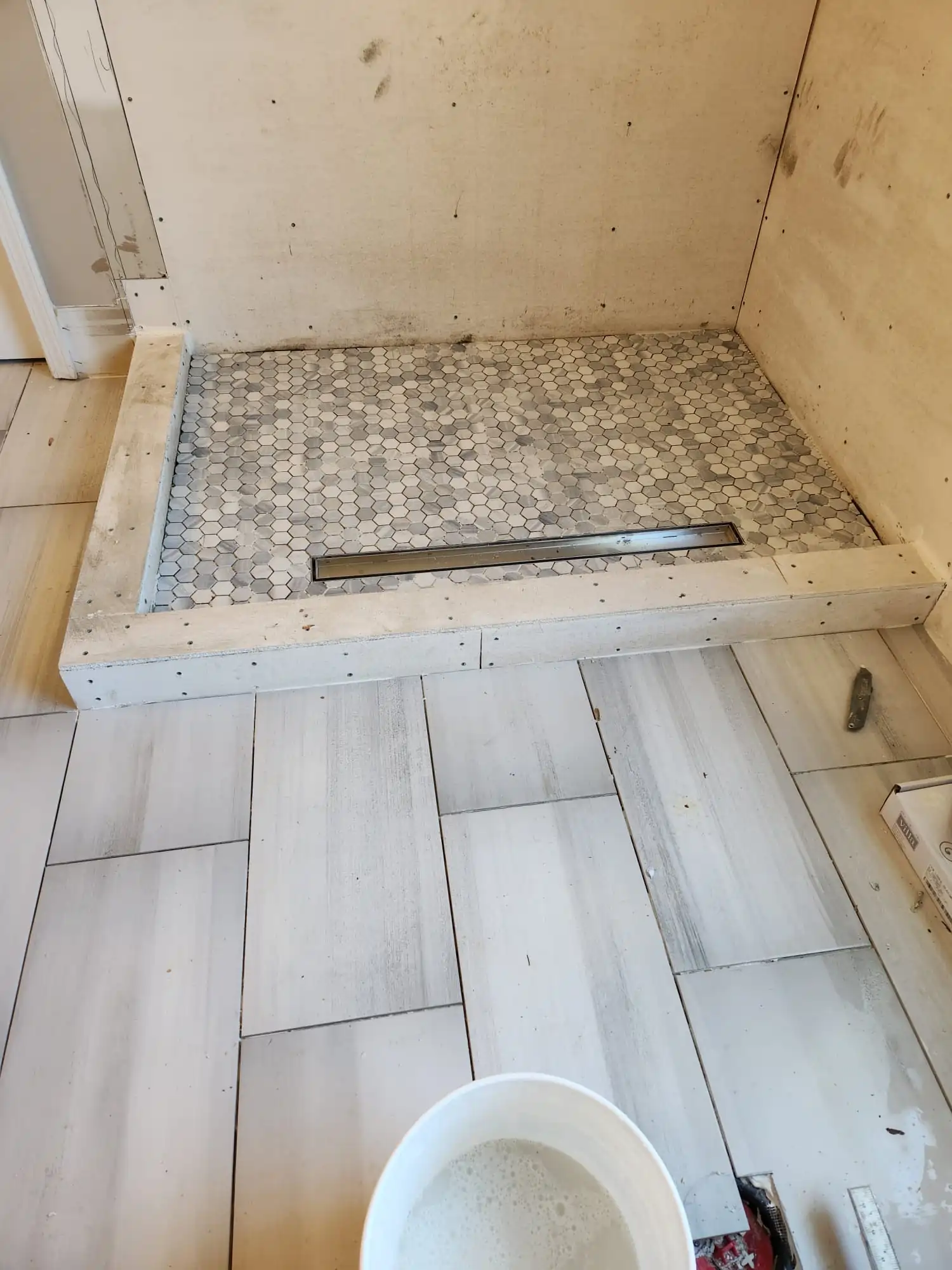 Tile flooring in shower and bathroom