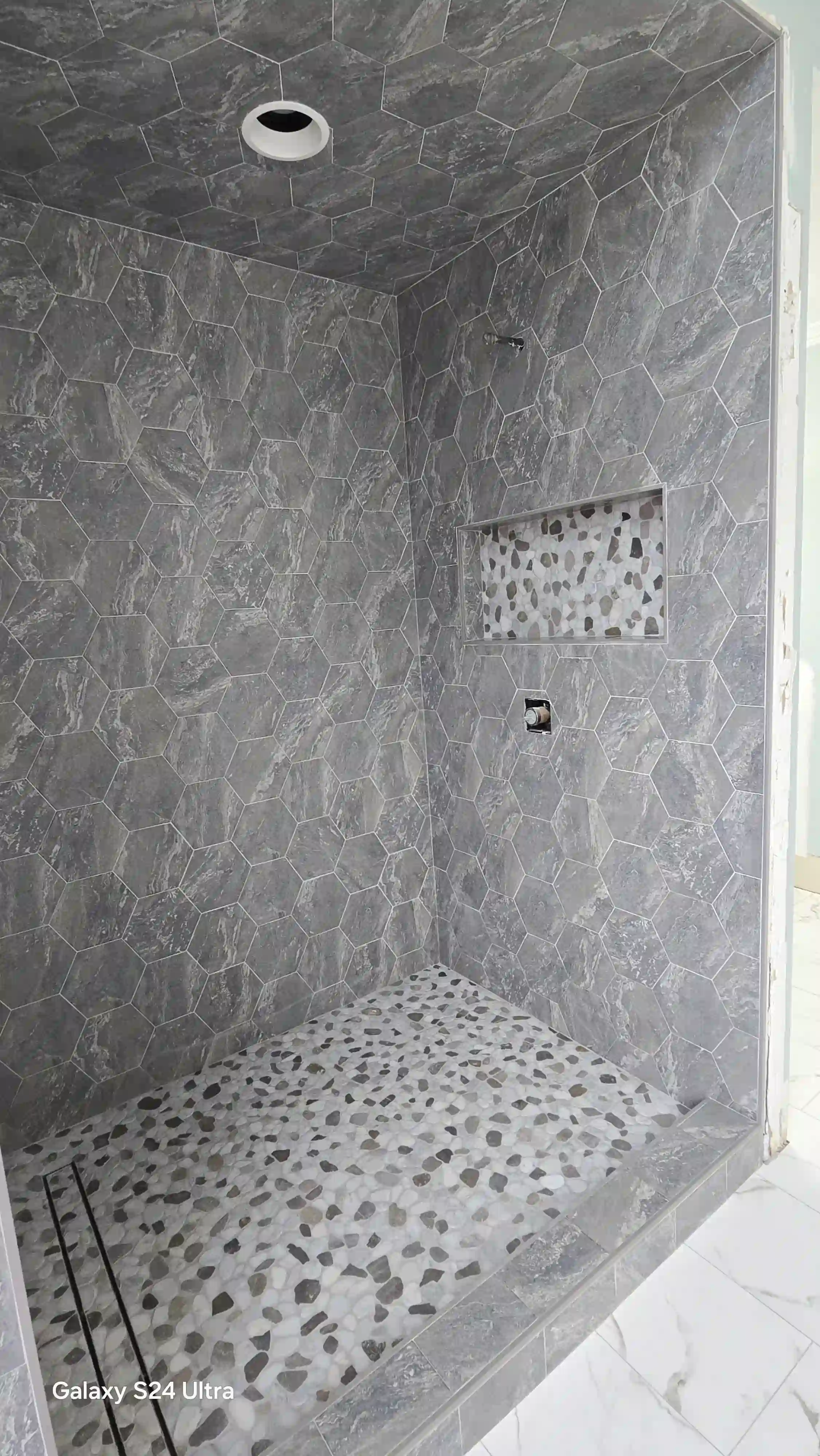 Tile flooring in shower and bathroom